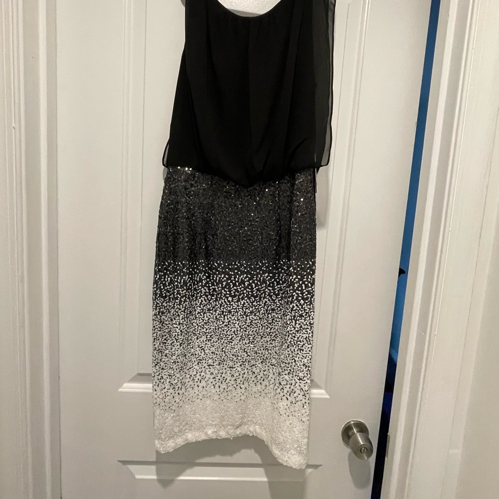 Super cute black and white dress- drapey top and fitted sequined skirt.